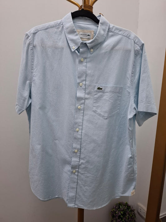 CAMISA MANGA CORTA LACOSTE COLOR CELESTE BEBÉ - TALLA L